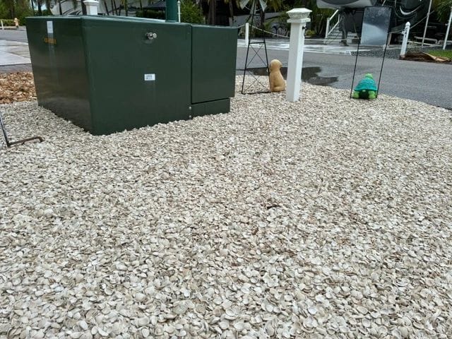 Crushed shell surface around a utility area