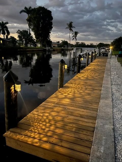 Wooden dock on a canal at dusk