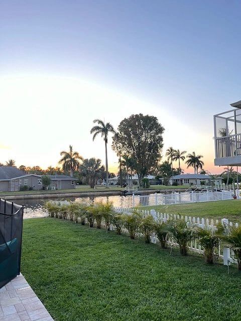 Planted border and lawn at the edge of a waterfront yard
