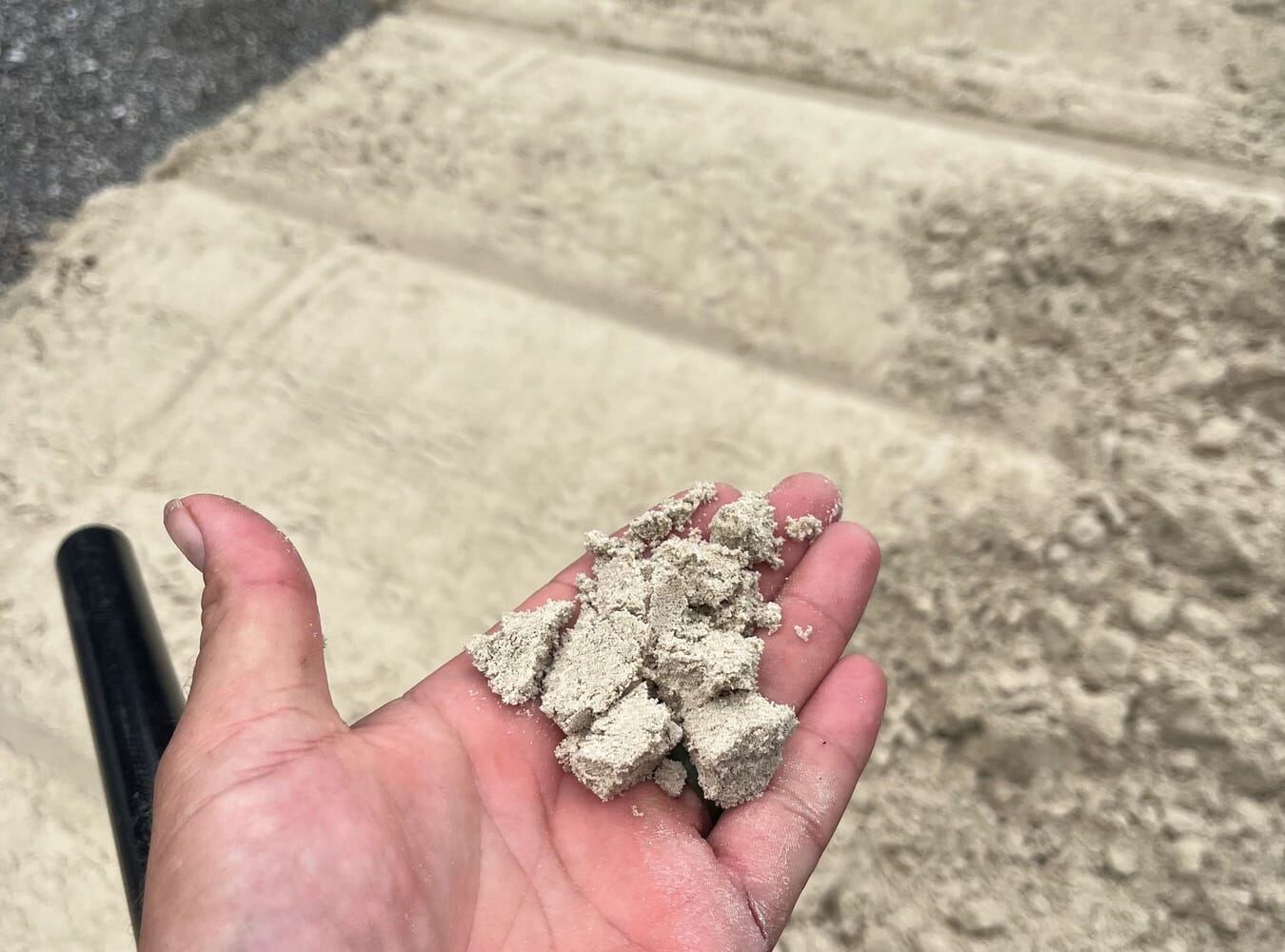 Handful of paver sand