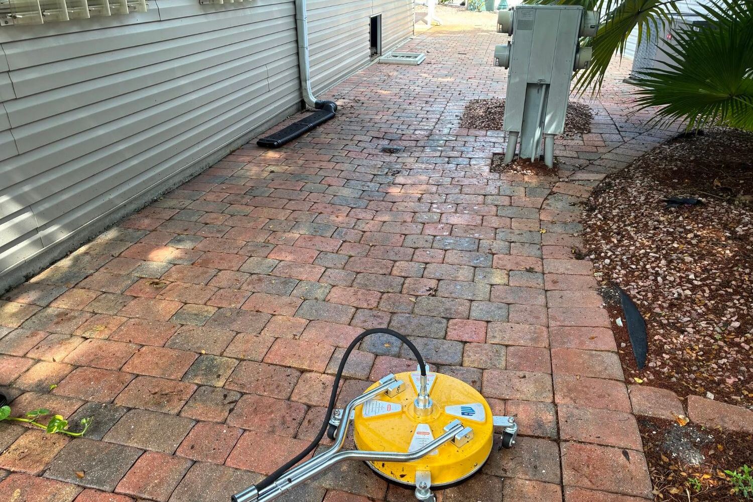 Surface cleaner washing a paver walkway