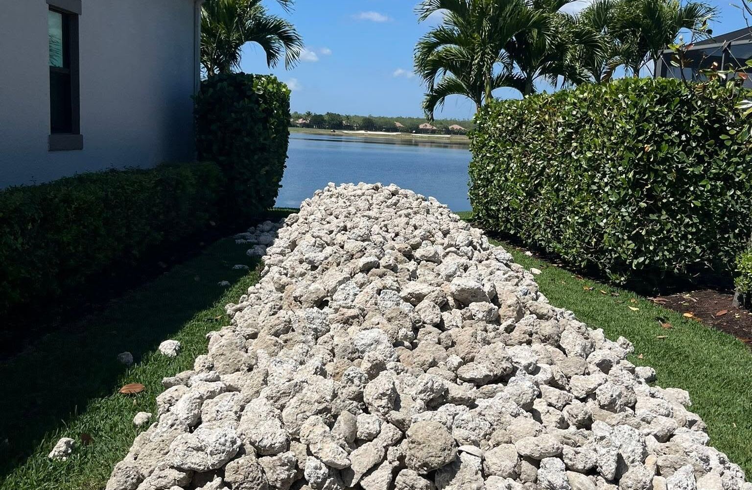 Rip rap staged along a lakefront side yard